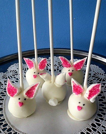 A bunch of cake pops with pink bunny ears