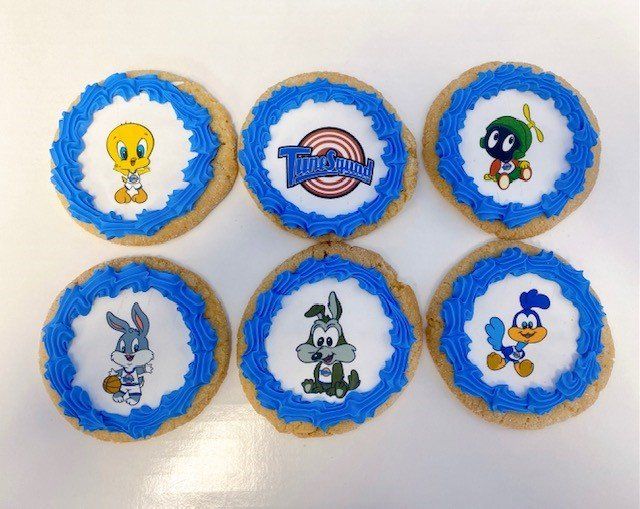 A bunch of cookies with looney tunes characters on them