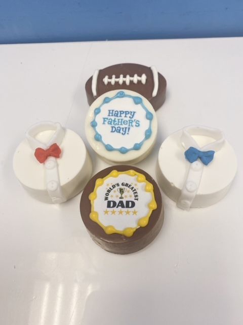 A father 's day cookie with a football on it