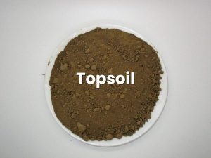 A white plate with topsoil written on it