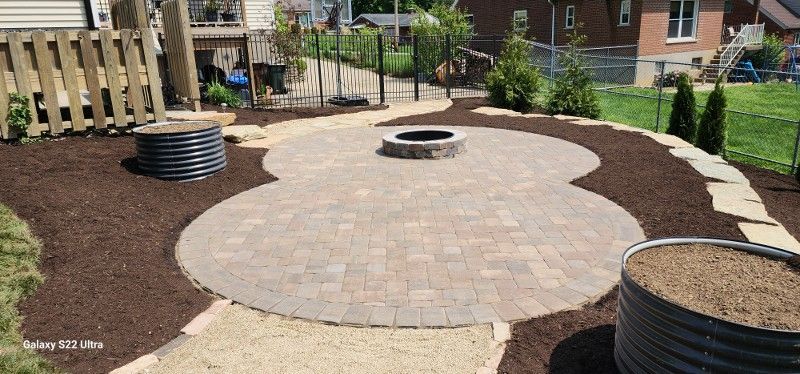 There is a fire pit in the middle of the patio.