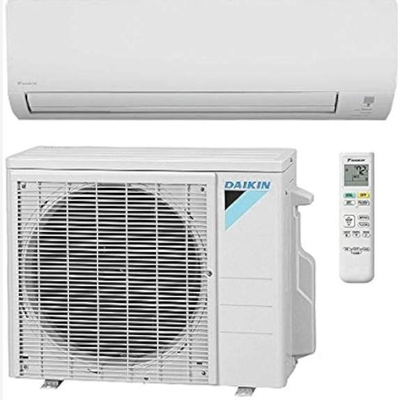 a daikin air conditioner is sitting next to a remote control .