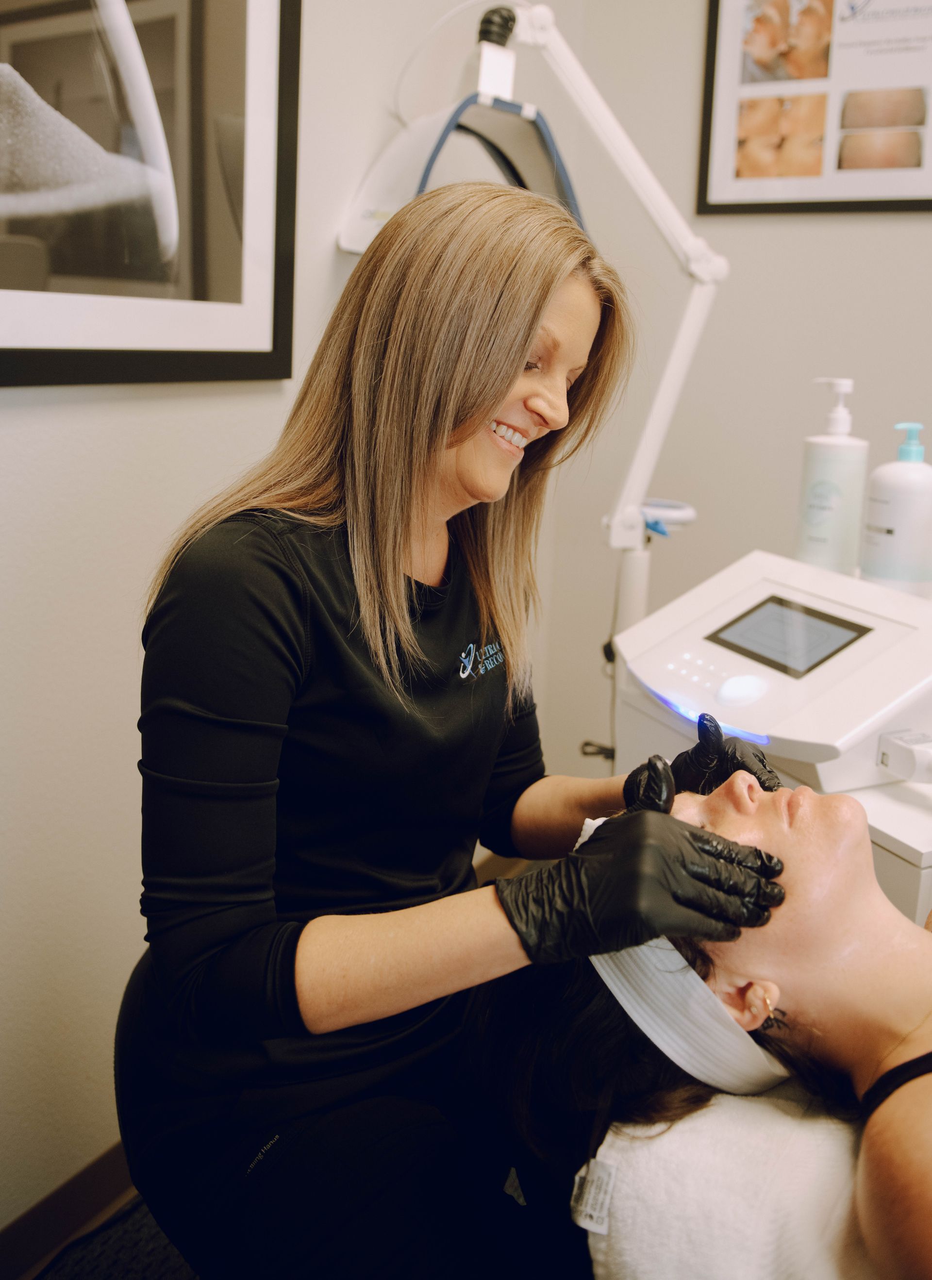 A woman is giving a man a facial treatment in a beauty salon.
