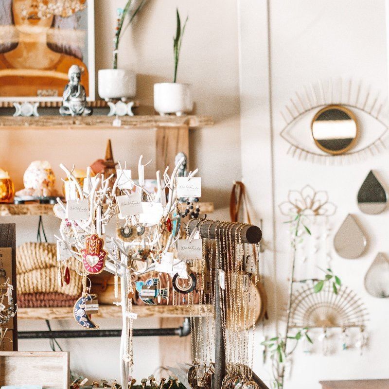 A store filled with lots of jewelry and a mirror with an eye on it