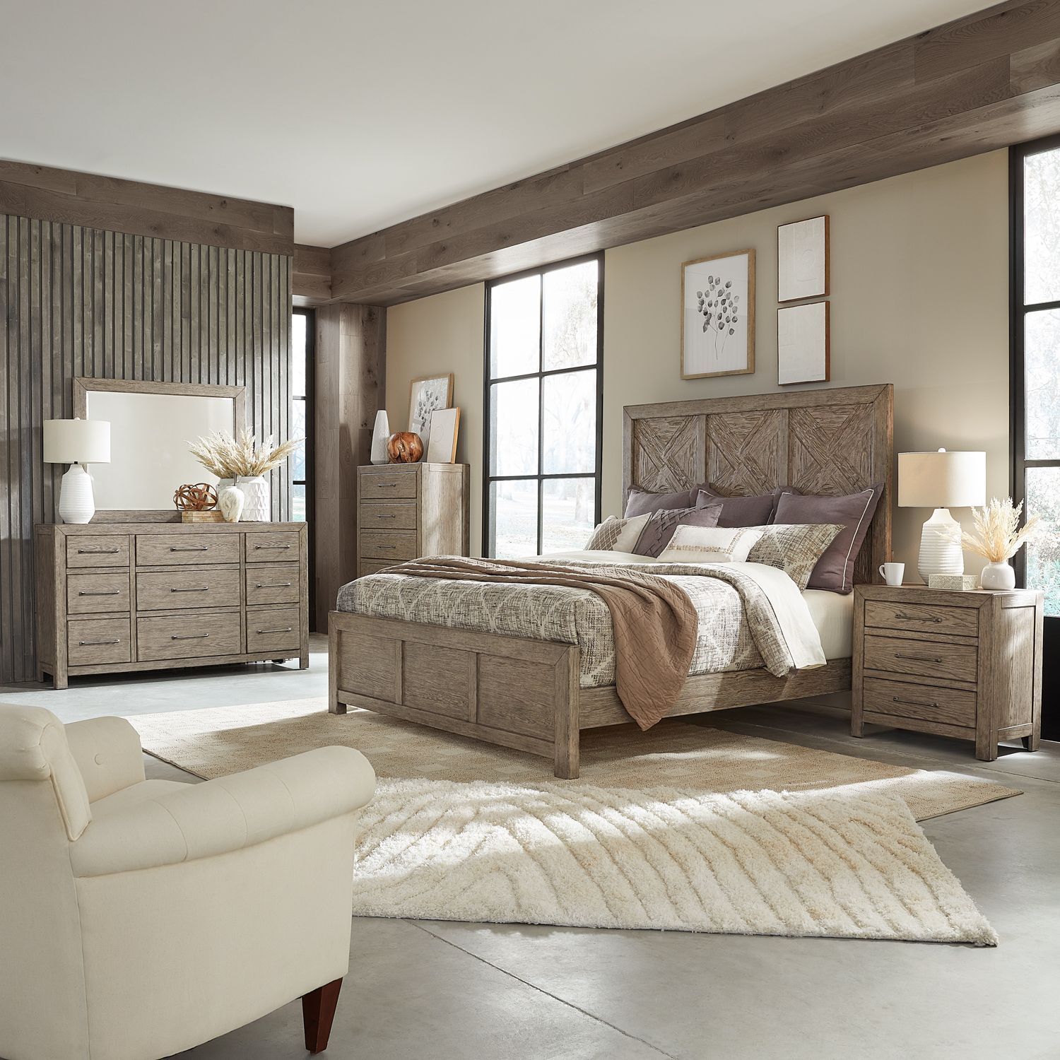 A bedroom with a bed dresser and nightstand