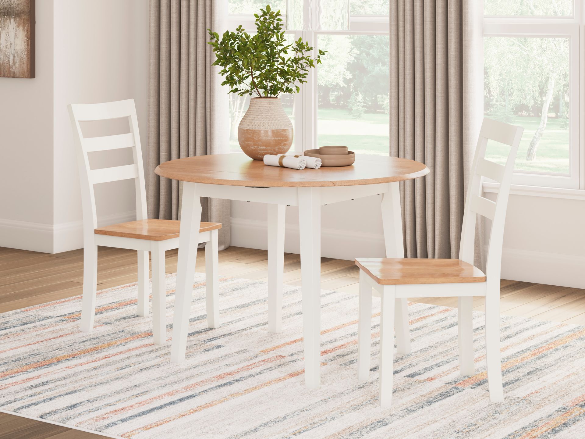 A dining room table and chairs are sitting on a rug in front of a window.
