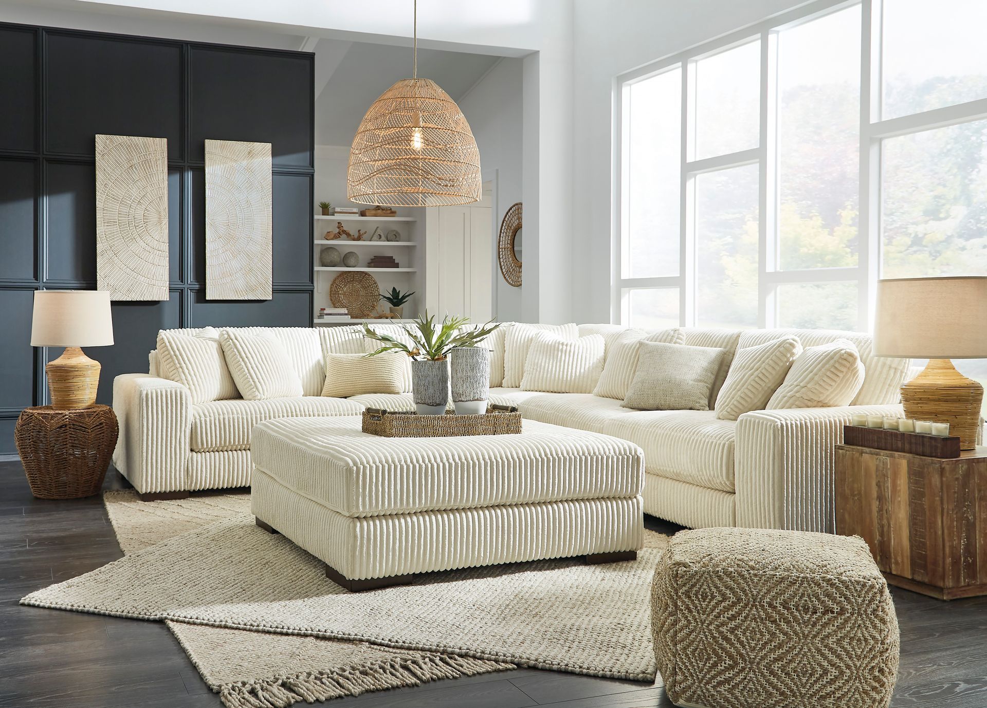 A living room filled with furniture and a large sectional couch.