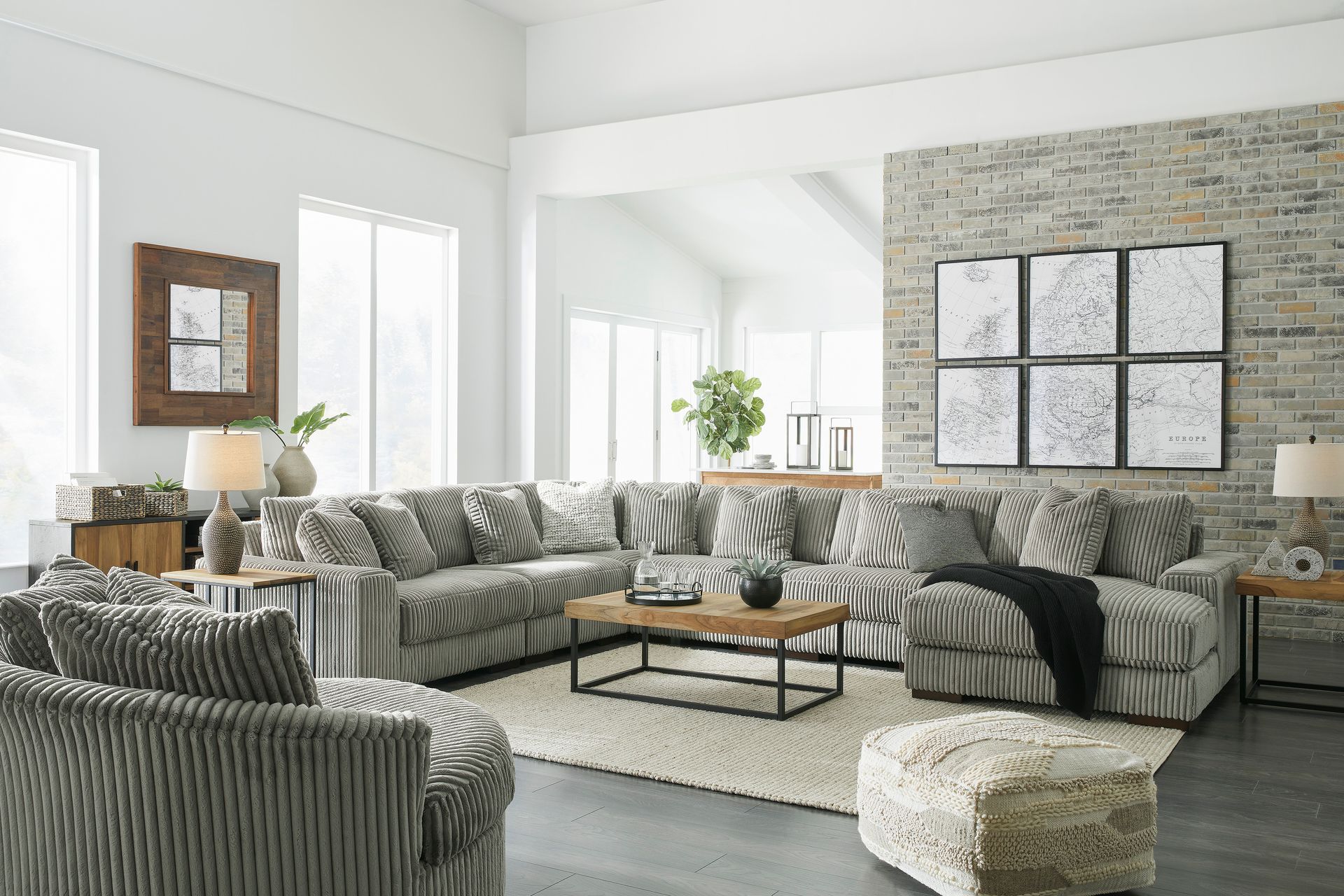 A living room filled with furniture and a large sectional couch.