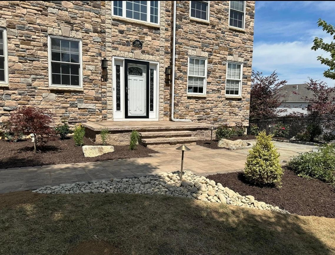 A large stone house with a white door and windows