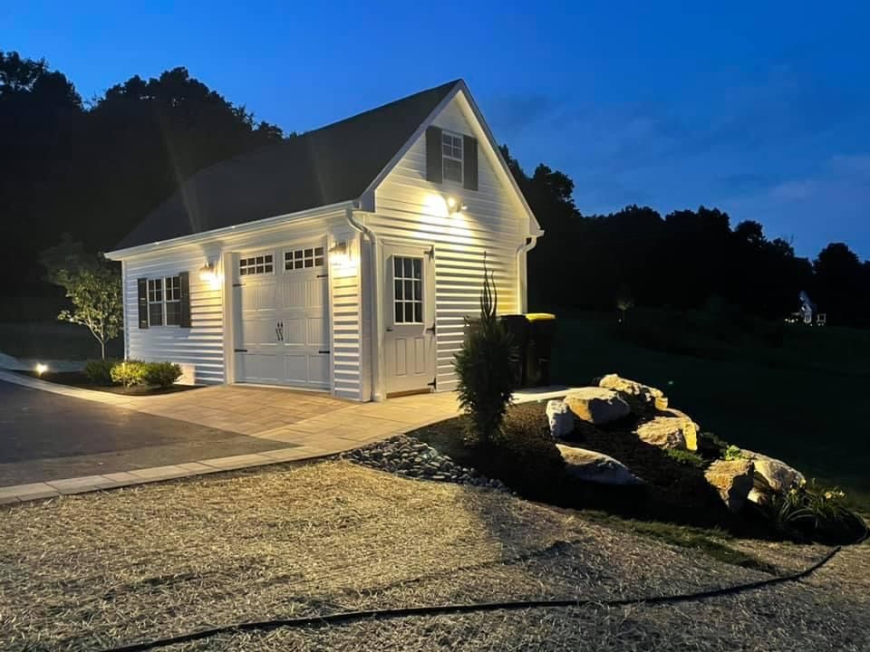 exterior of a white house with warm lighting
