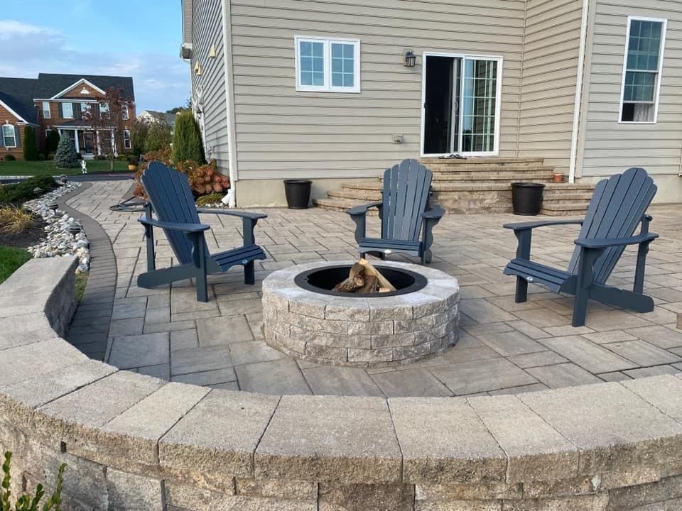 wooden chairs around a fire pit