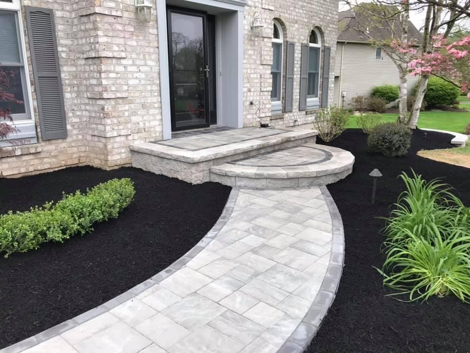 white patio leading to the door
