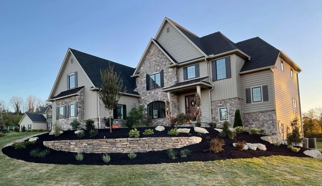 huge beautiful house with a landscape in front