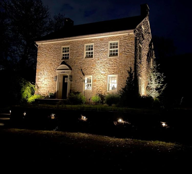 front of a huge house with lighting