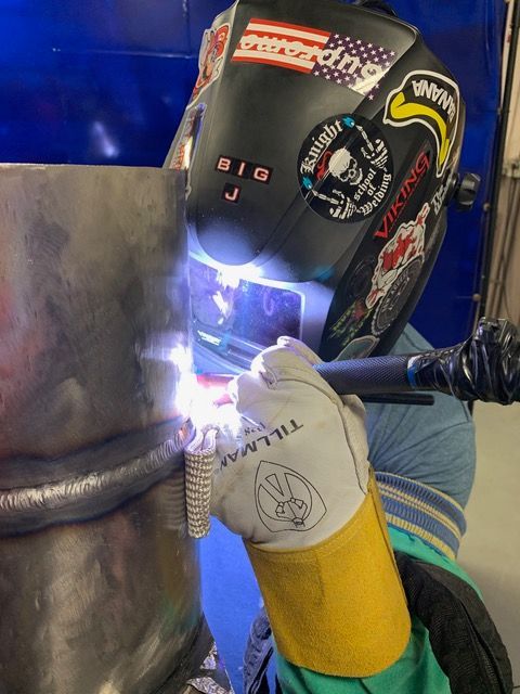 Student welding iron