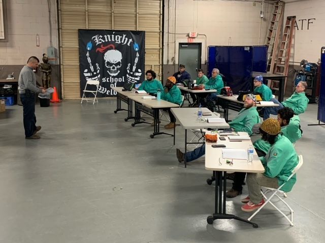 Welding students in a classroom