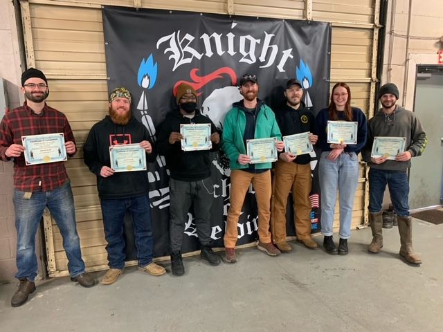Students holding their certificates