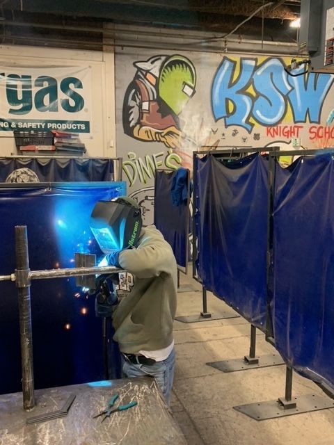 Student studying to be a welder