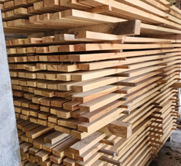 A pile of wood is stacked on top of each other.