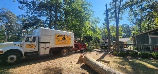 A white truck is parked in front of a house.