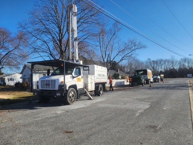 A white truck is parked on the side of the road.