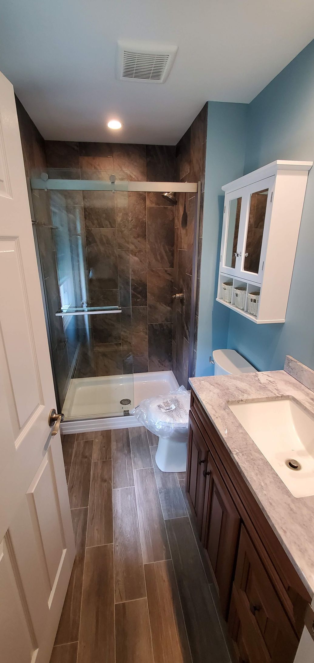Bathroom with a sink, toilet, and shower
