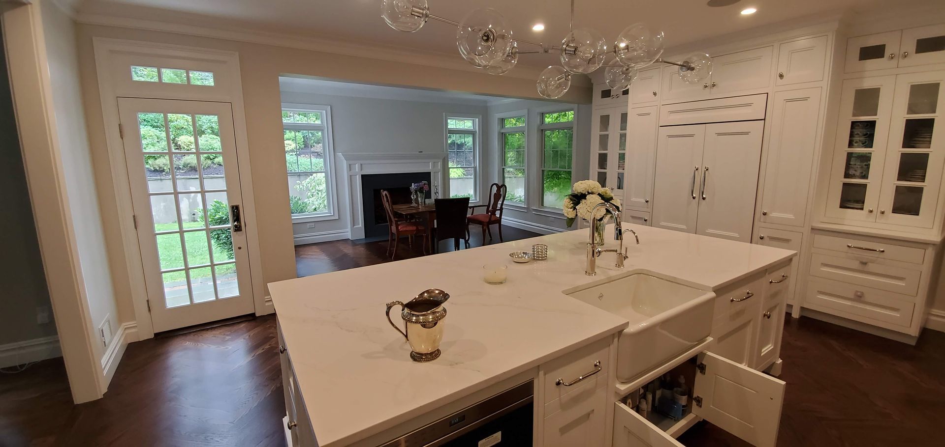 A kitchen with a large island and a sink