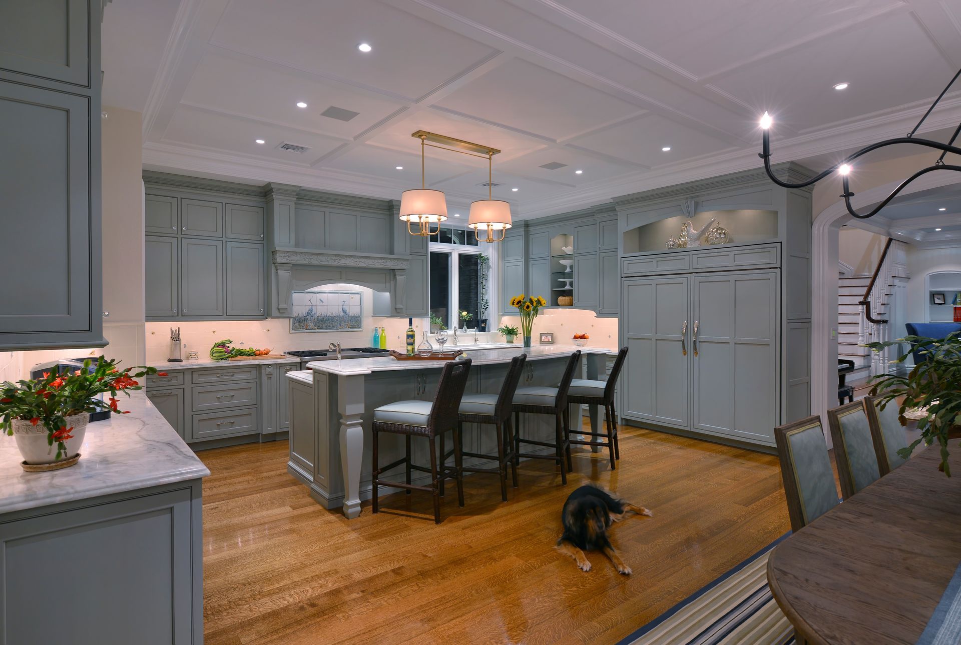 Kitchen with a large island and a dog on the floor