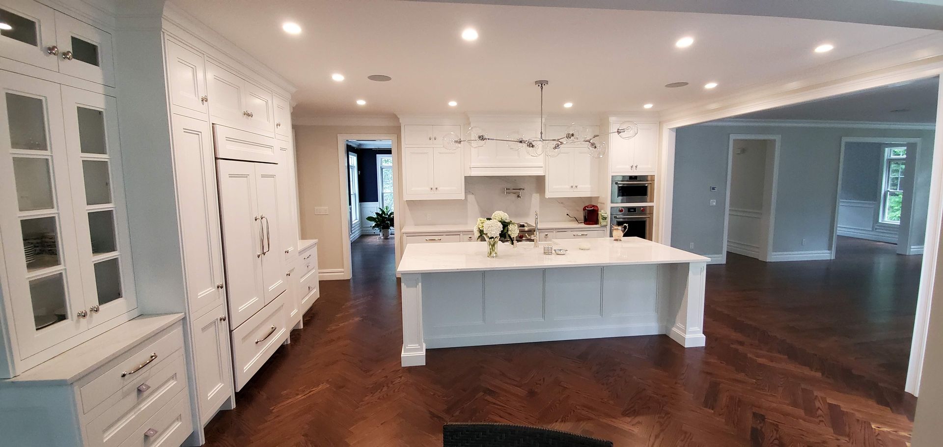 Kitchen with white cabinets and a large island in the middle