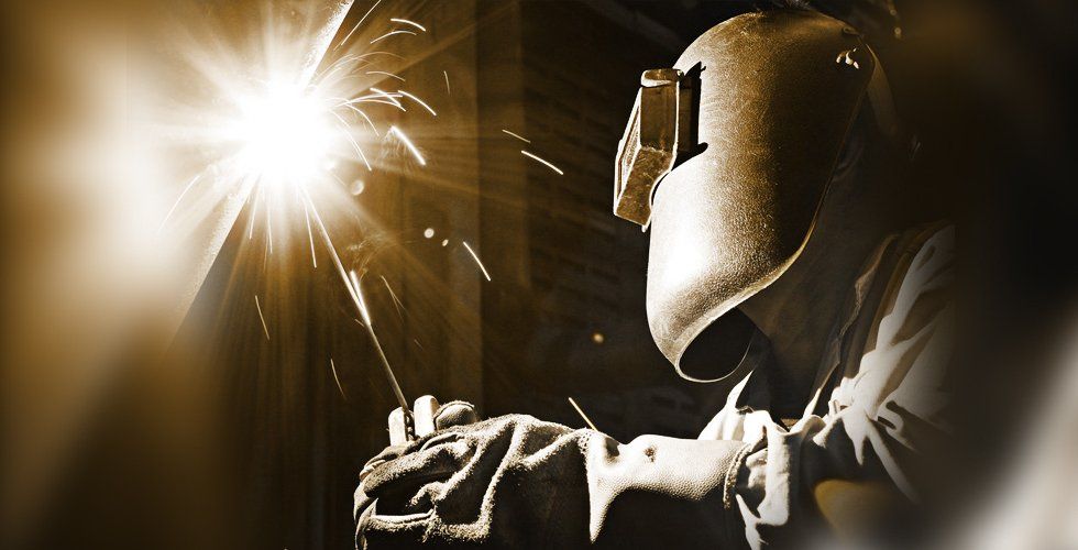 Man doing welding in a mask