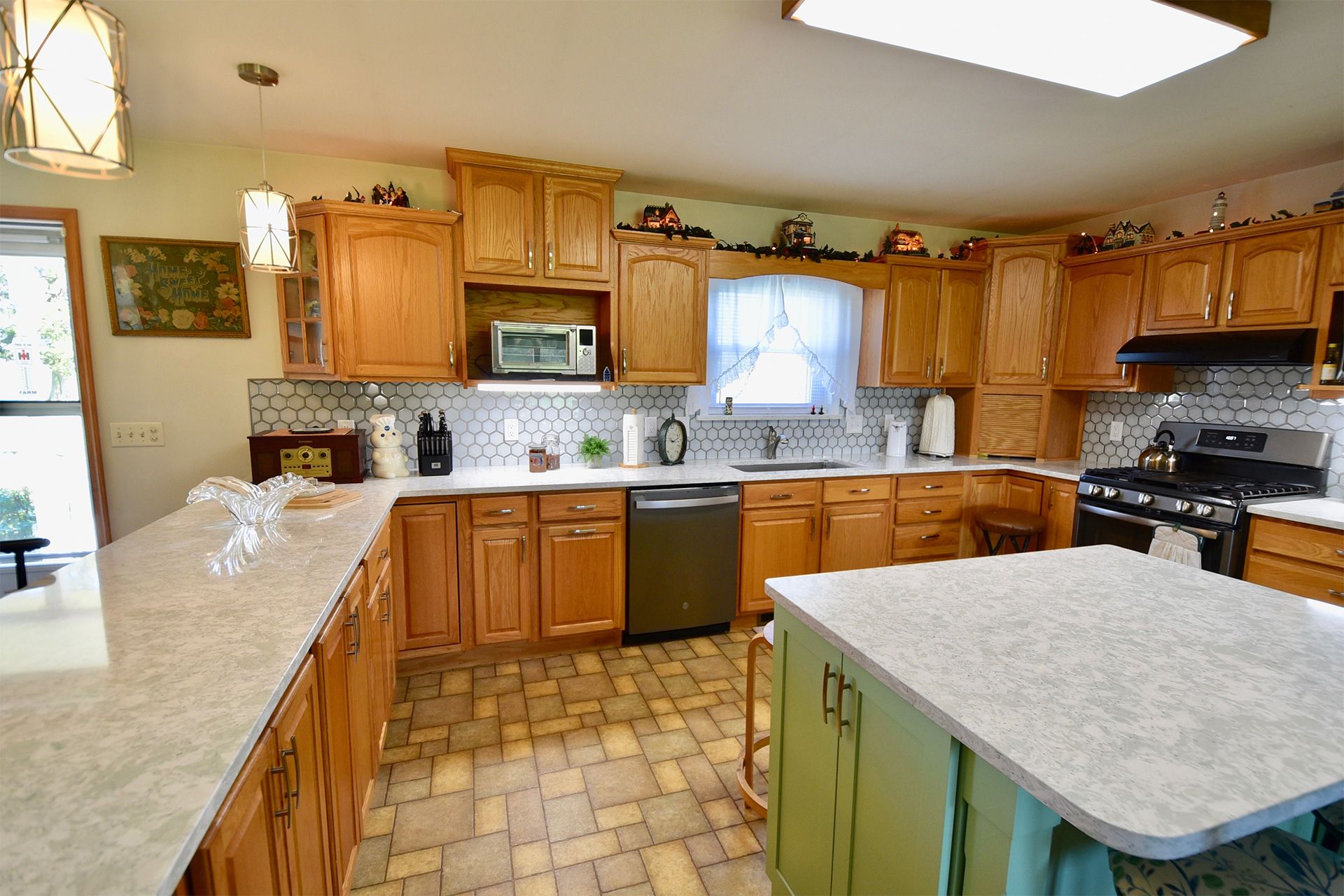 A kitchen with wooden cabinets and granite counter tops