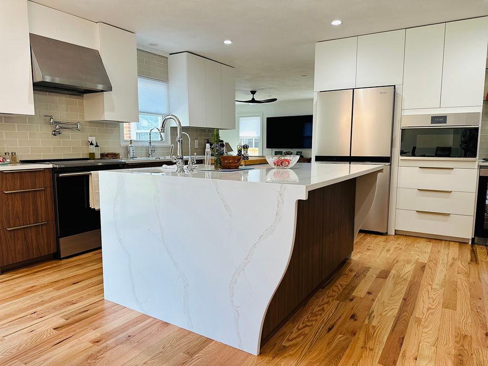 There is a large island in the middle of the kitchen.
