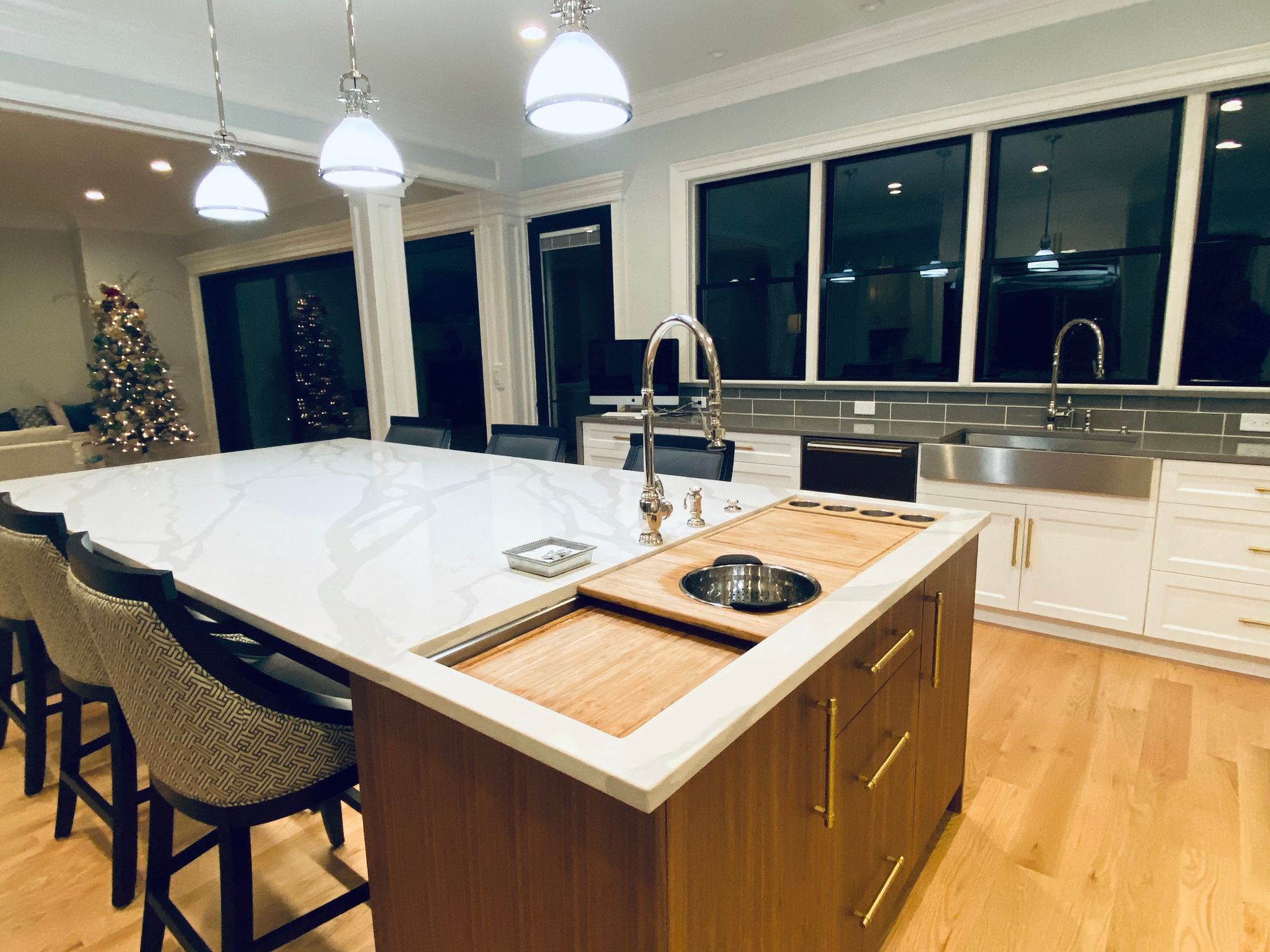 A kitchen with a large island and a sink.