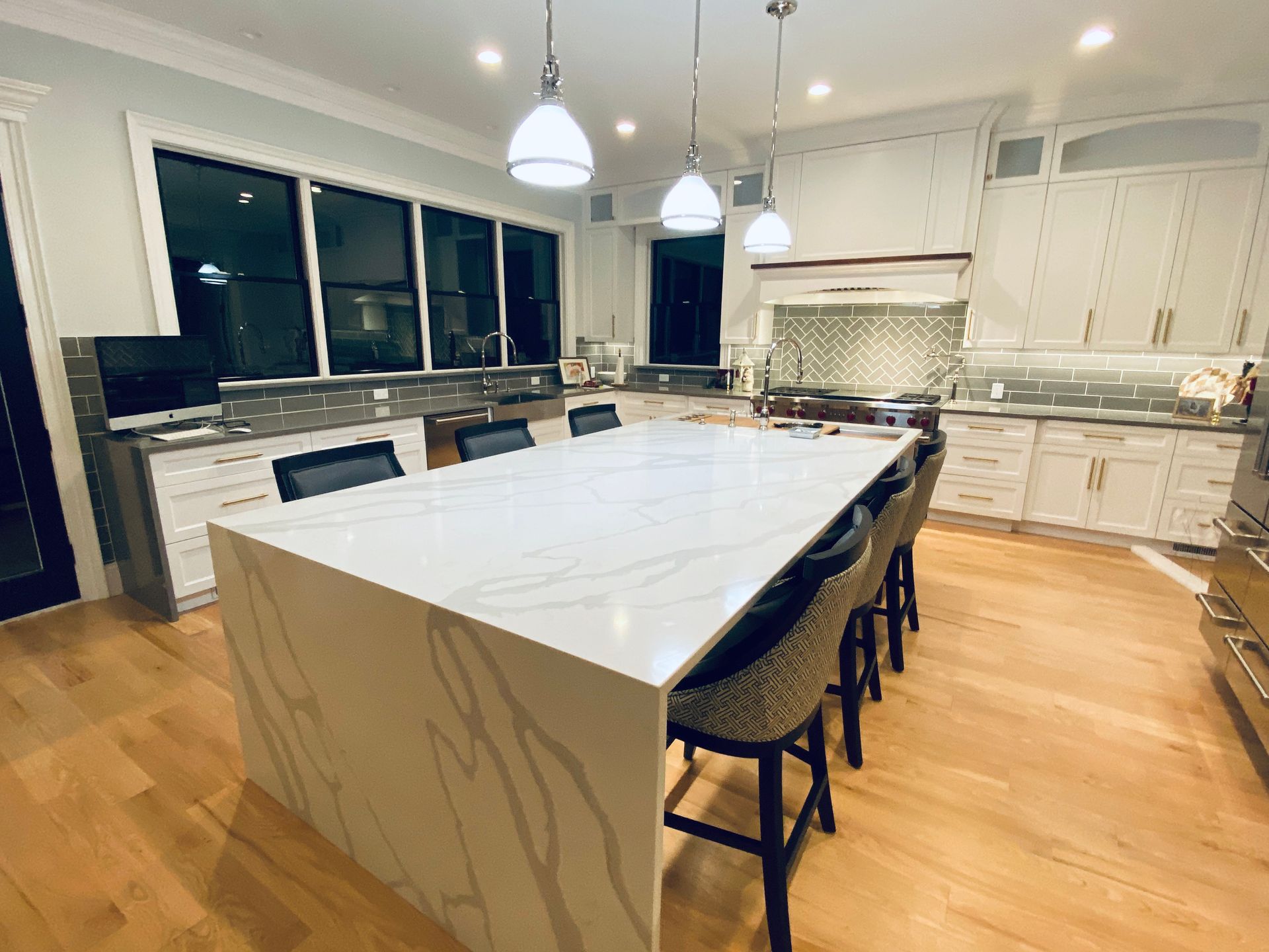There is a large island in the middle of the kitchen.