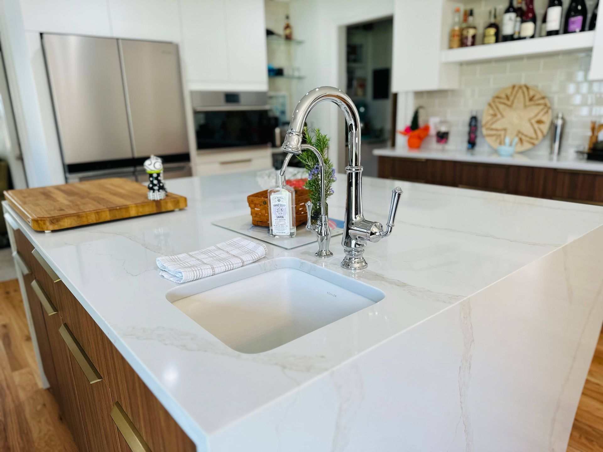 A kitchen with a sink and a faucet on the counter.