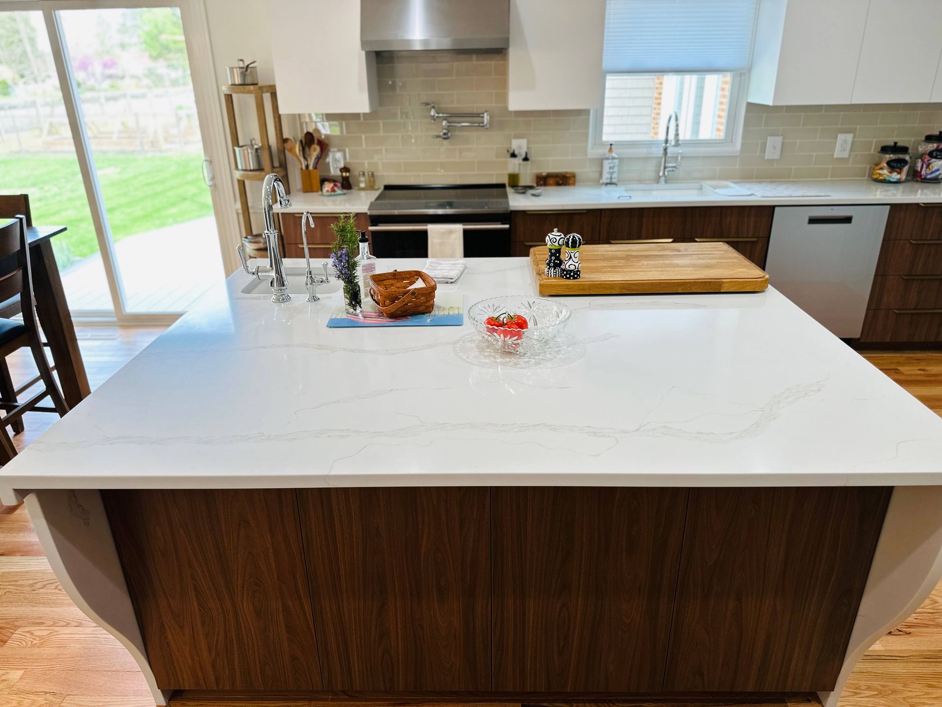 There is a large island in the middle of the kitchen.