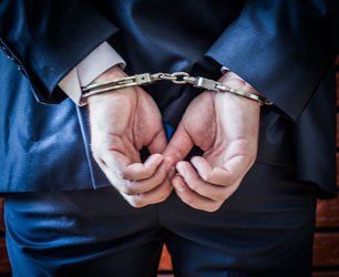 Hands on the back handcuffed