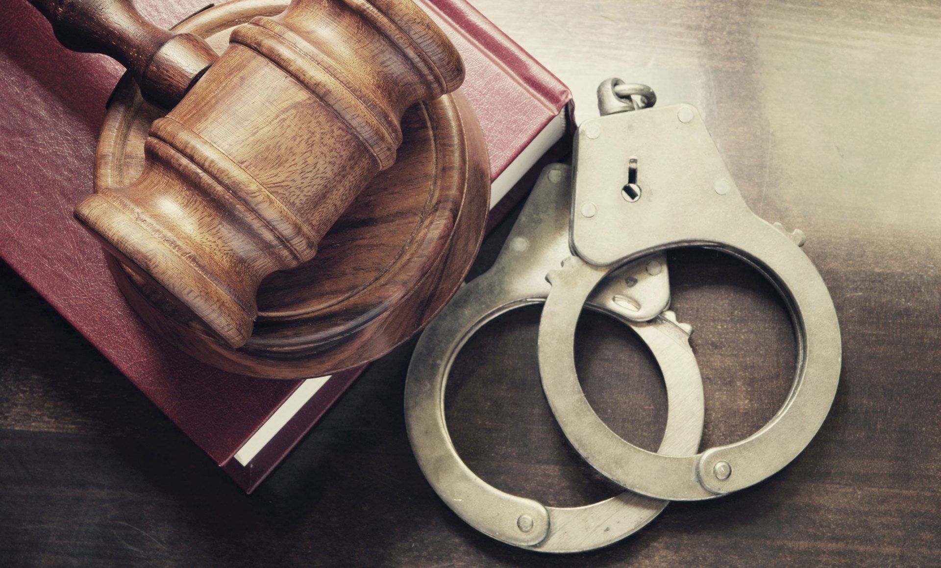 Learn More About Traffic and Criminal Law Gavel and handcuffs
