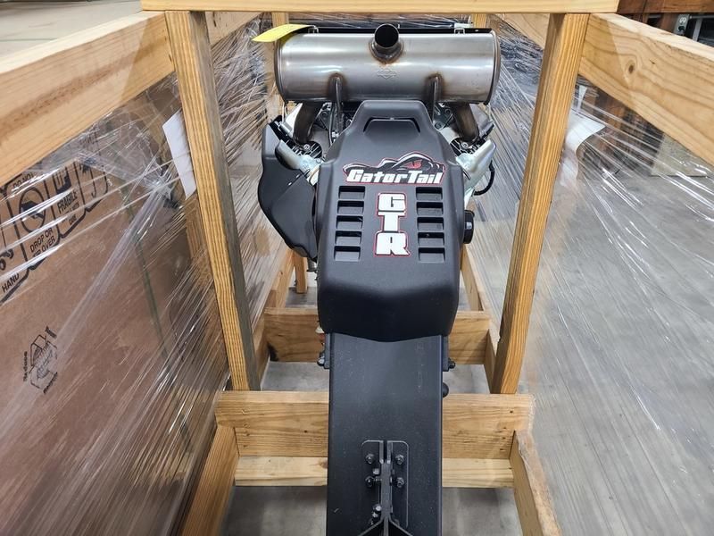 A pontoon boat is floating on top of a body of water.