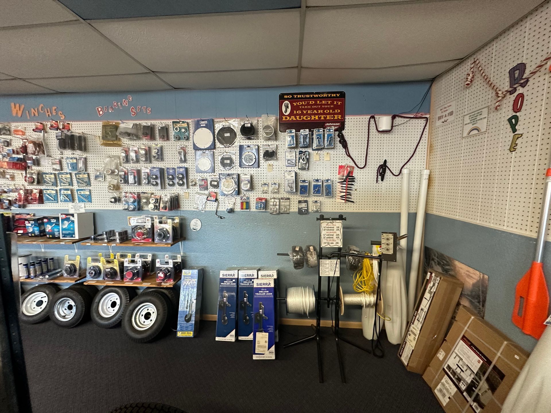 A room filled with lots of items on shelves and a wall.