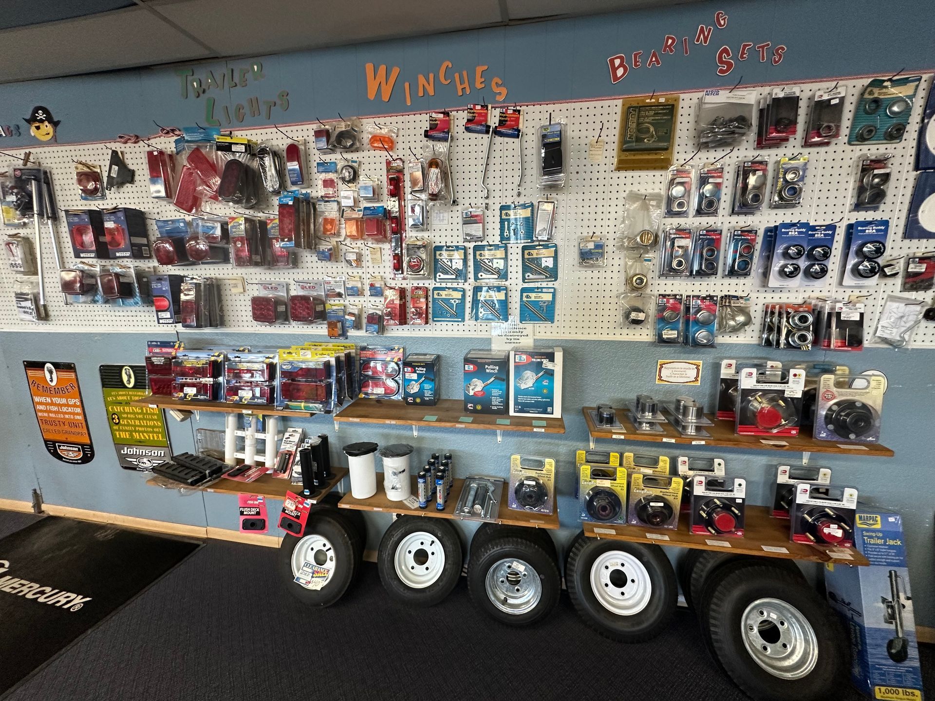 A wall filled with a variety of trailer parts and accessories