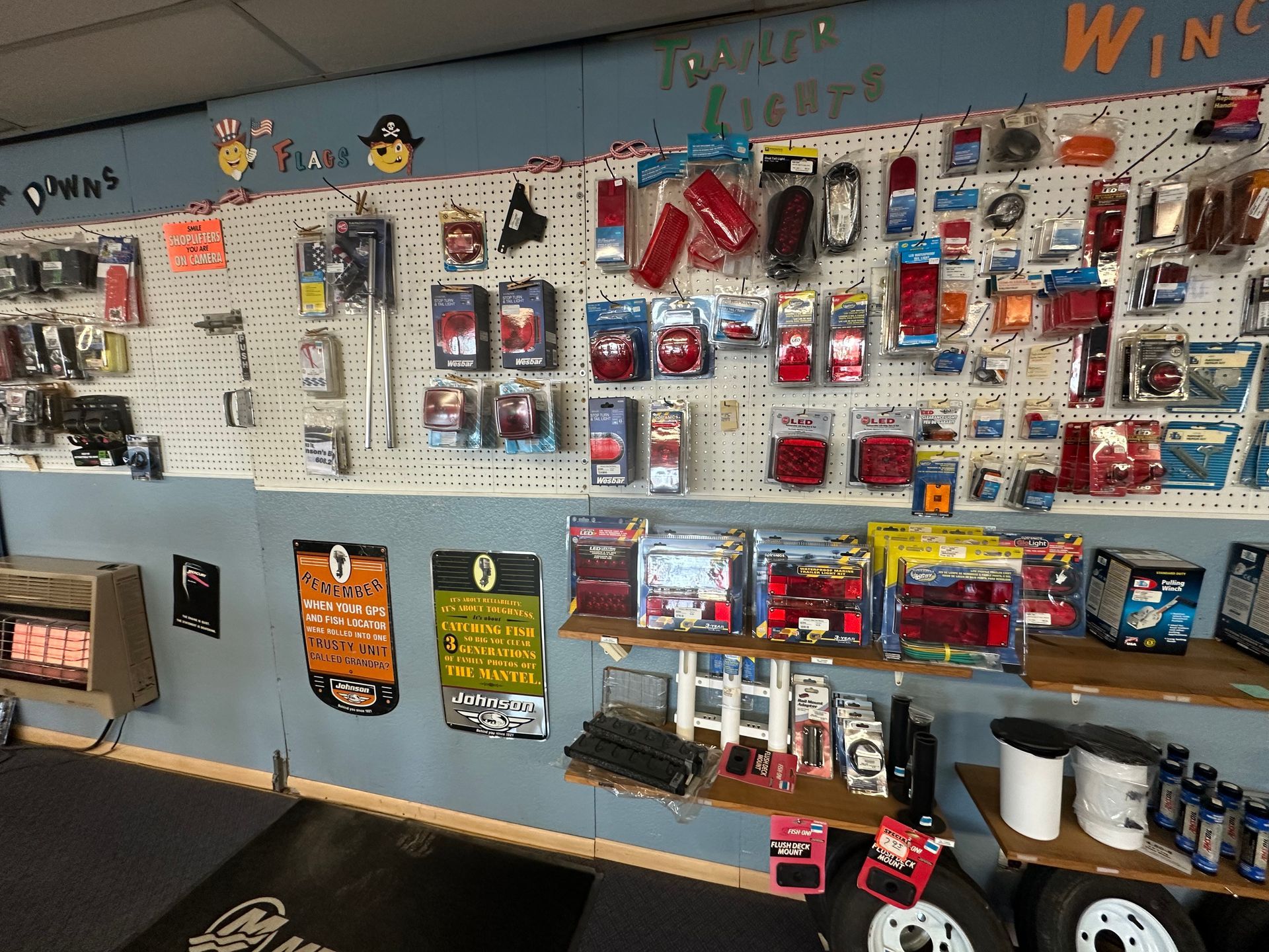 A wall filled with lots of trailer lights and accessories