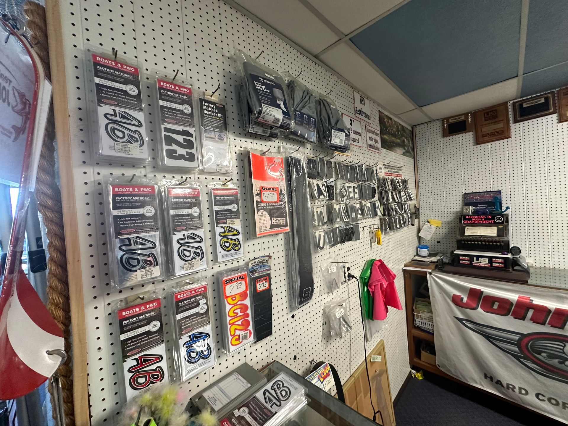 A wall with a lot of stickers on it in a store