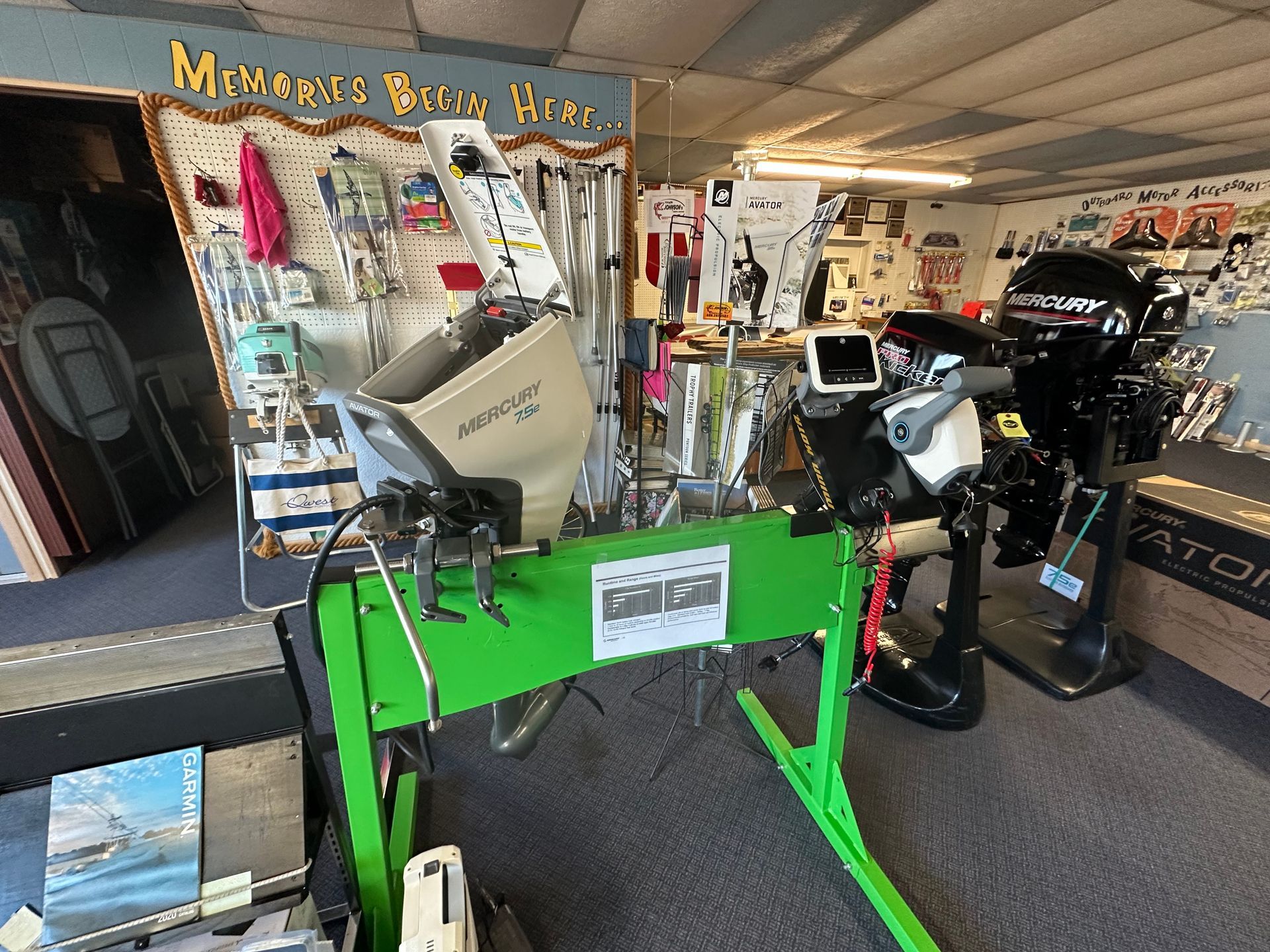 A green table with a motor on it in a store.