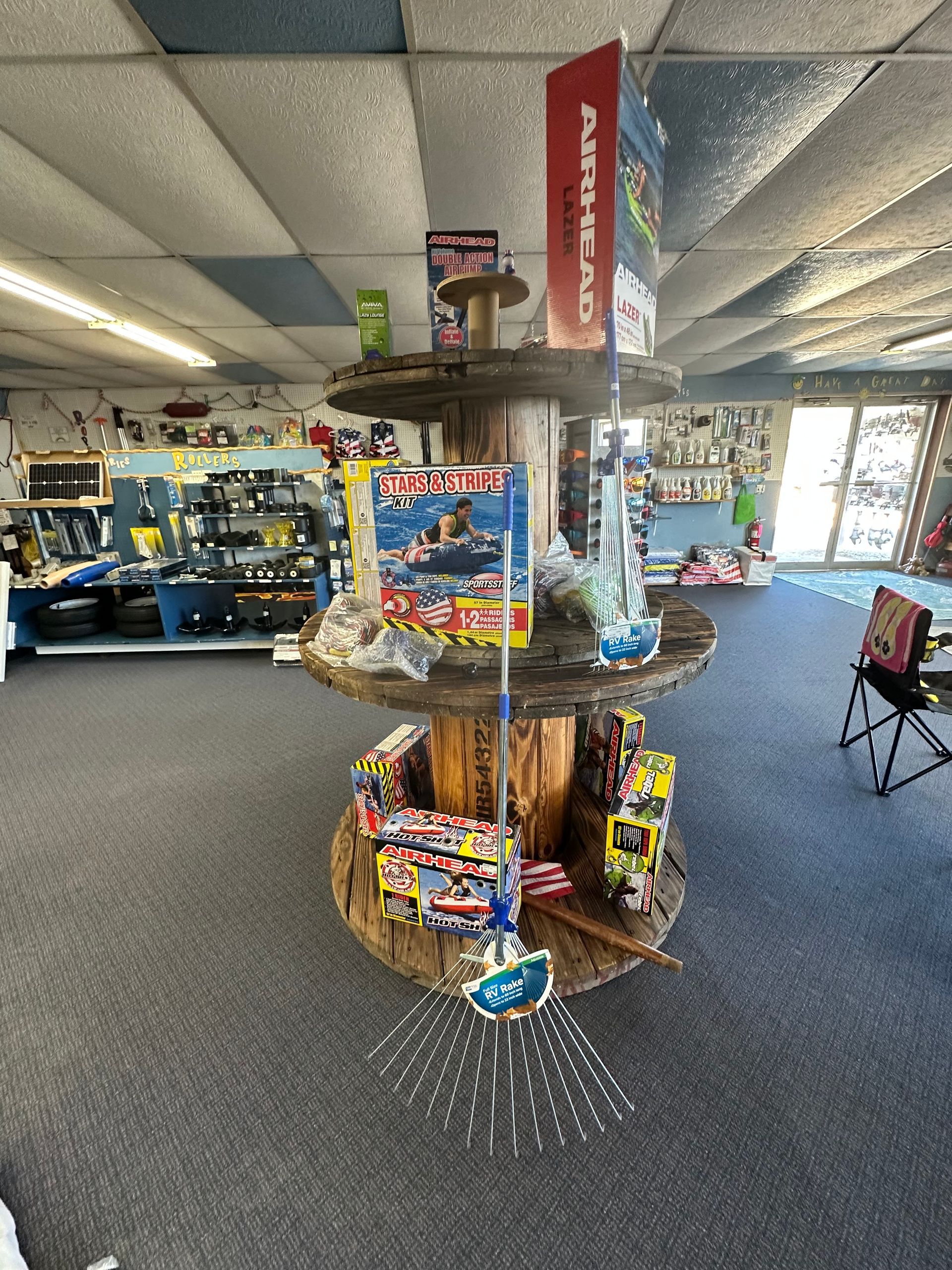 A store with a display of fireworks on a wooden spool