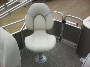 A white chair is sitting on the deck of a pontoon boat.