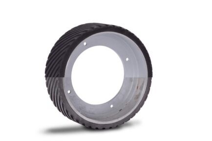 A close up of a tire with a hole in the middle on a white background.