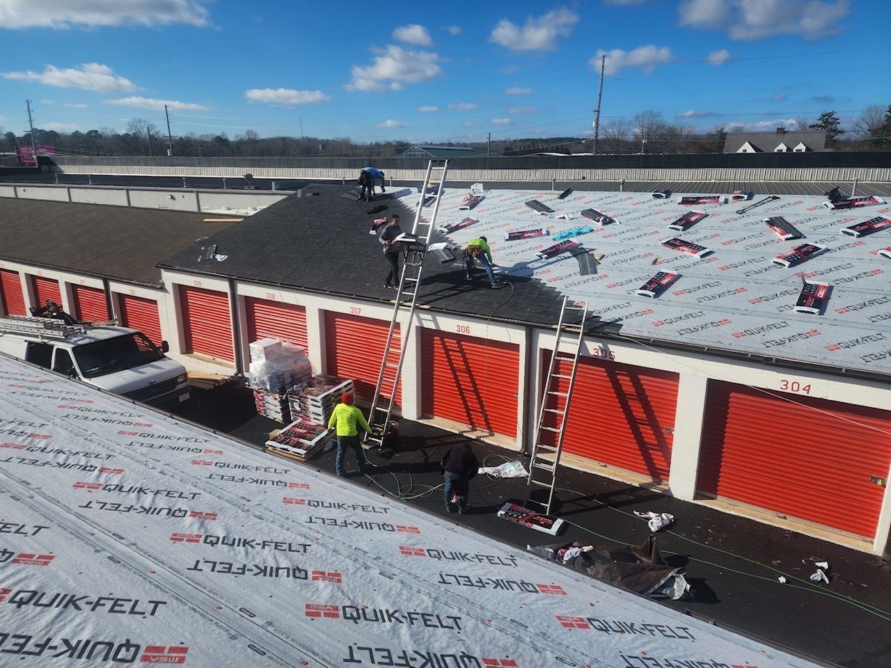 View from a roof of a commercial area, a billboard in the distance.