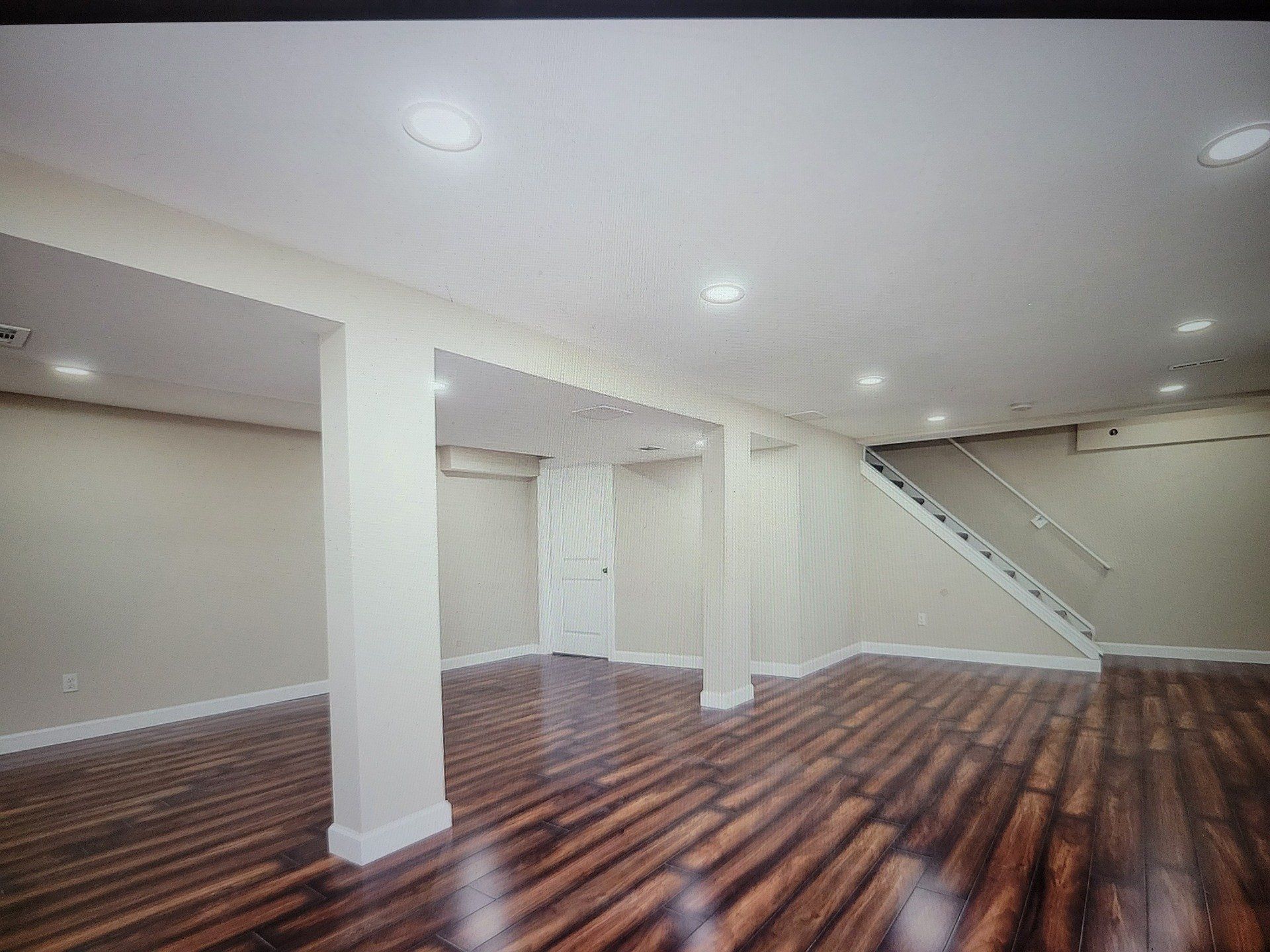 Open basement with wooden floor