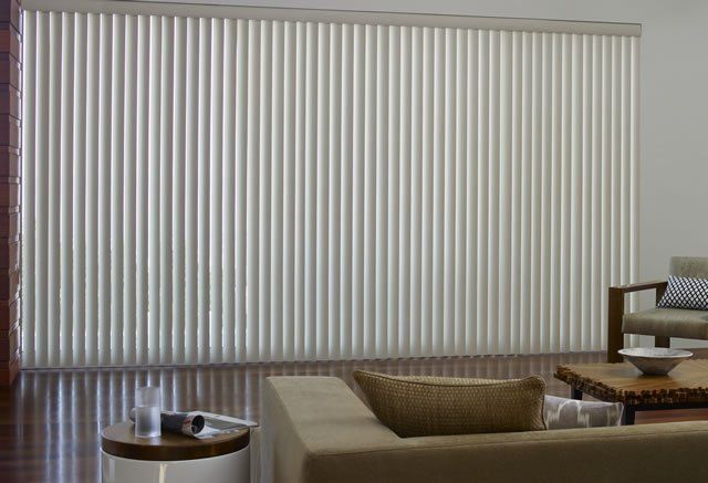 vertical blinds installed in lounge room on large window for adjustable light control